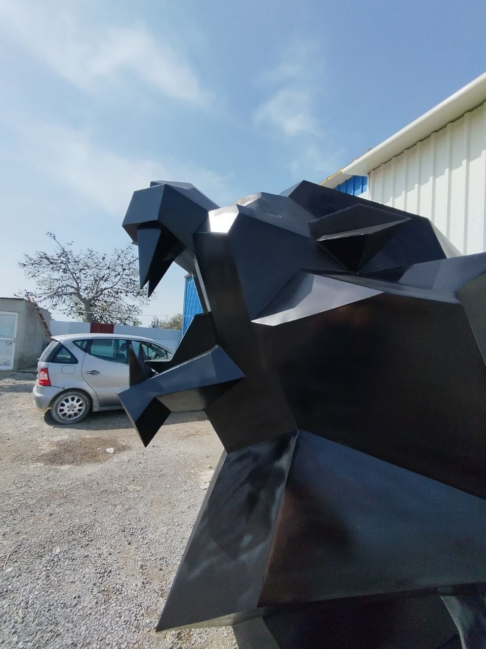 Close-up of steel sculpture facets — welding and grinding